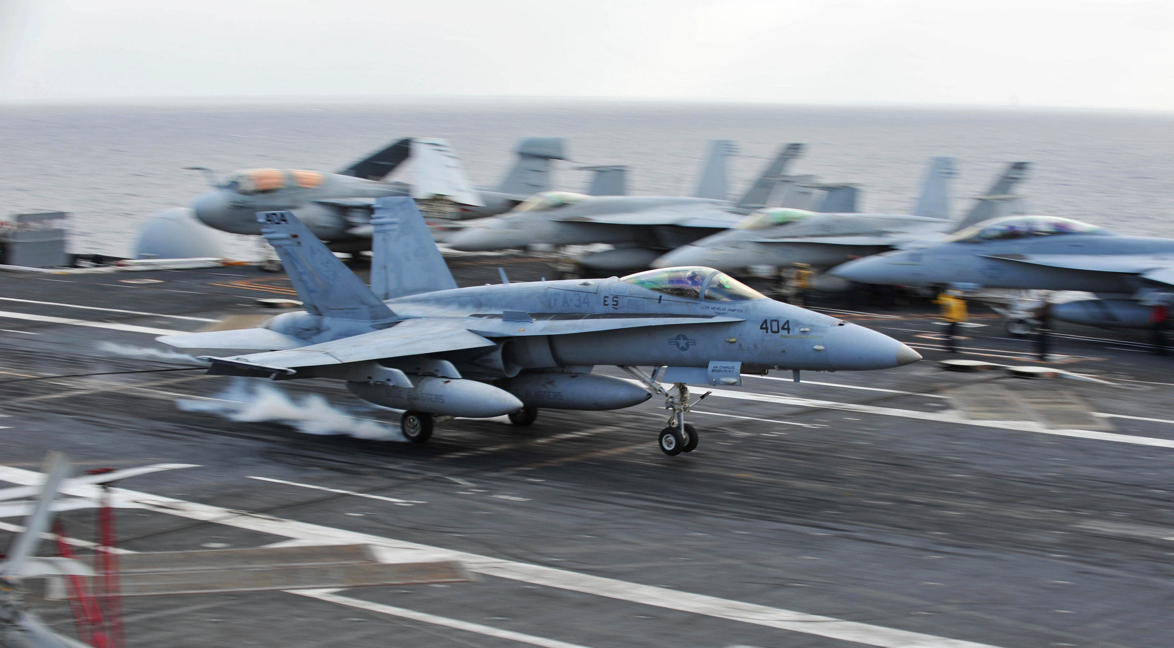 An F/A-18 Hornet assigned to the Blue Blasters of Strike Fighter Squadron (VFA) 34, lands on the flight deck of the aircraft carrier USS Ronald Reagan (CVN 76). Ronald Reagan and the embarked Carrier Air Wing (CVW) 2 are underway conducting carrier qualifications. (U.S. Navy photo by Mass Communication Specialist 3rd Class Charles D. Gaddis IV/Released)