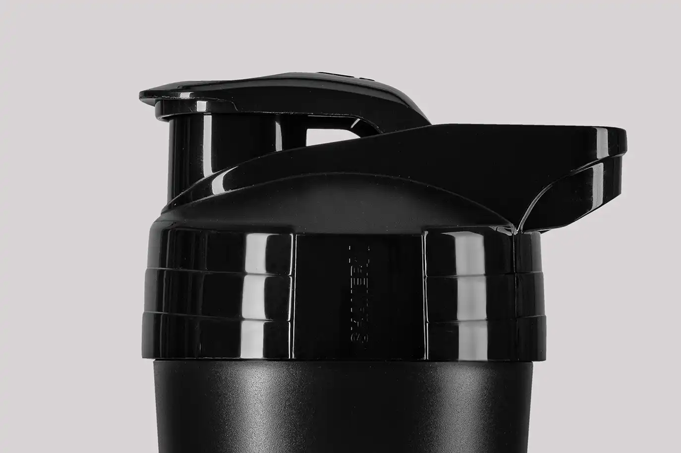 black shaker with a screw cap